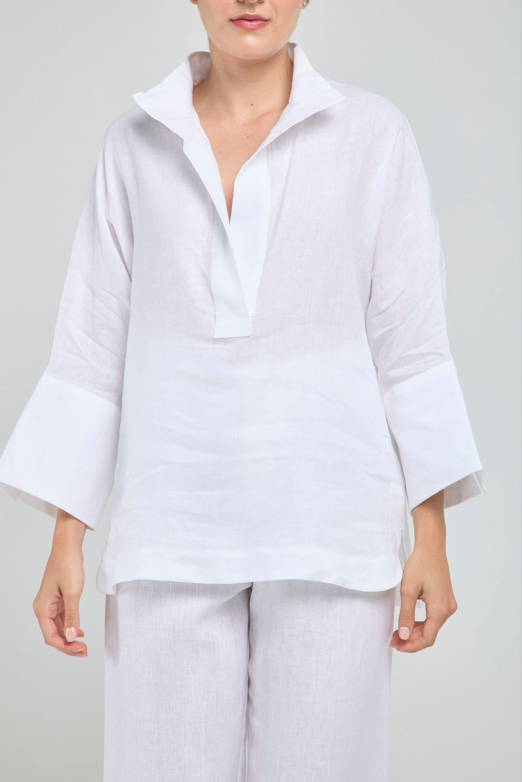 BLUSA LINO PERILLA INTERRUMPIDA  CORTE ATRAS CURVA R