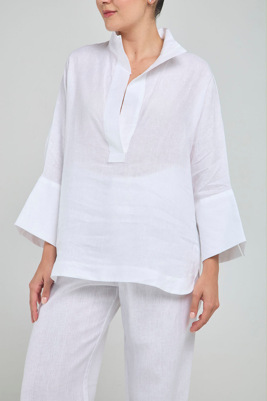 BLUSA LINO PERILLA INTERRUMPIDA  CORTE ATRAS CURVA R