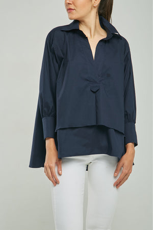 BLUSA ANCHA IMITACIÓN PERILLA DOBLE RUEDO ADELANTE