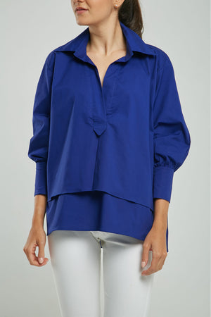 BLUSA ANCHA IMITACIÓN PERILLA DOBLE RUEDO ADELANTE