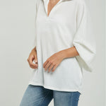 BLUSA TELA REPUJADA PERILLA INTERRUMPIDA  CUELLO CAMISERO  M/LAR