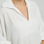 BLUSA TELA REPUJADA PERILLA INTERRUMPIDA  CUELLO CAMISERO  M/LAR